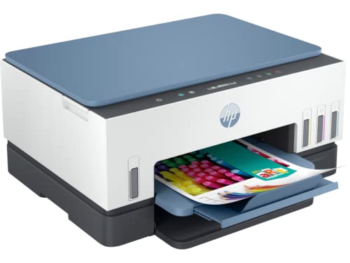 HP printer with a blue lid and open tray showing colorful paper.